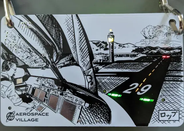 Aerospace Village badge showing a cockpit illustration with a runway and green lights